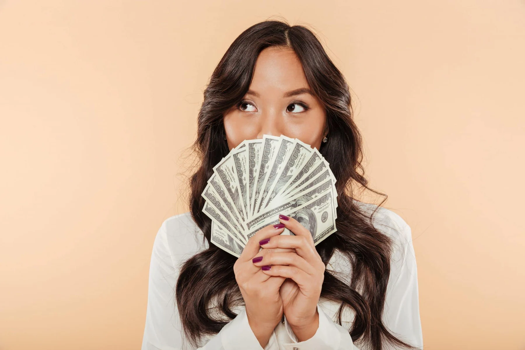 blog 1f026cef40e5 portrait successful asian woman covering mouth with fan 100 dollar bills being satisfied a